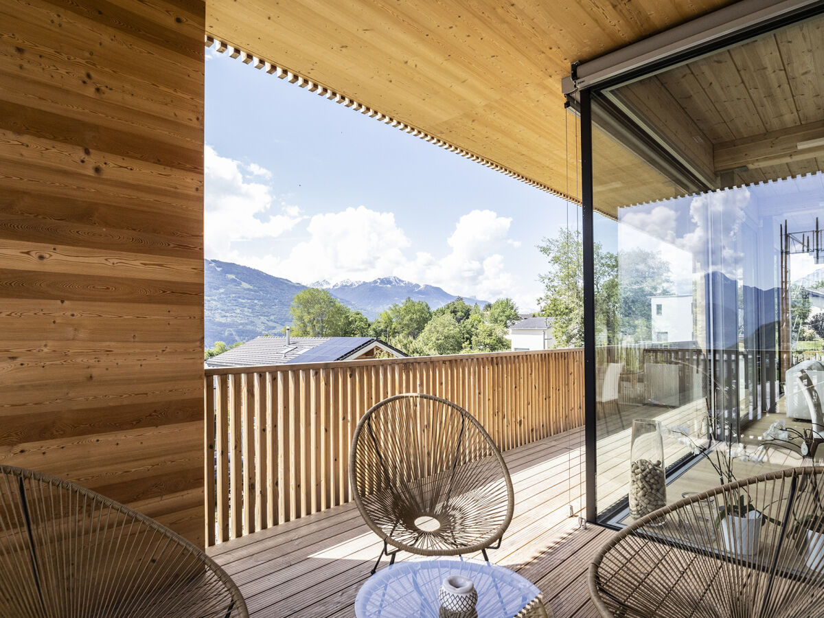 Modern log home in the swiss alps balcony